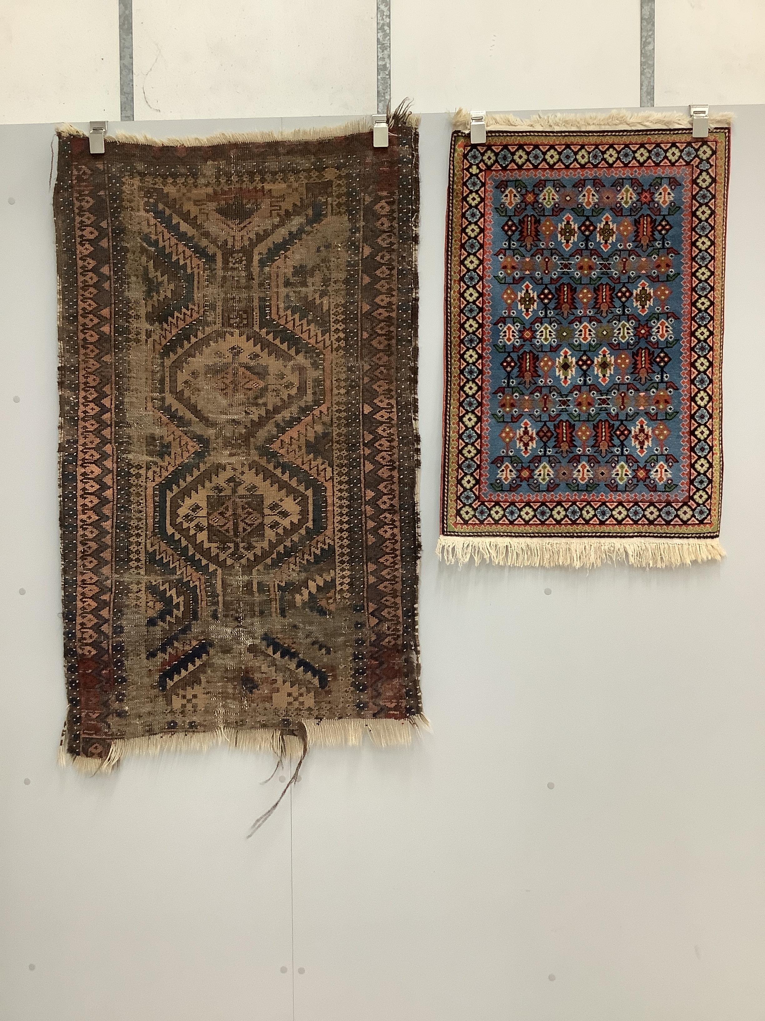 A Caucasian style red ground rug, a North West Persian figural rug, an antique Shirvan rug and one other rug (4), largest 121 x 99cm